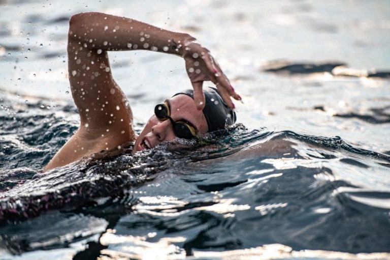 Open water swimmer practising front crawl technique during an intermediate coaching session in Stirlingshire